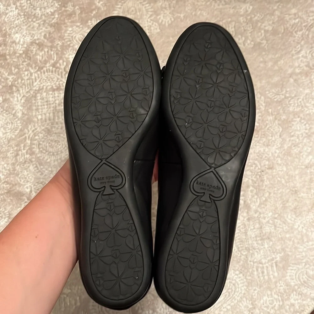 Brand New Kate Spade Genuine Leather Black Flats Slip On Shoes Silver Tone Logo
